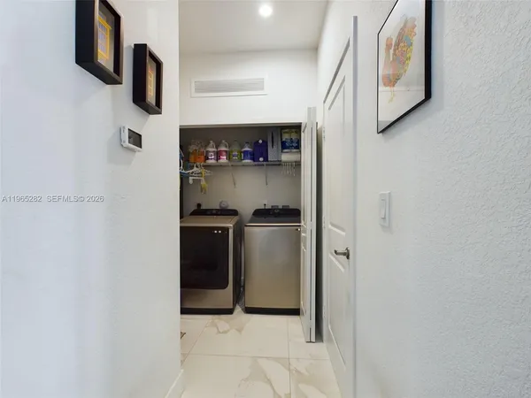 a kitchen with stainless steel appliances a refrigerator and a stove