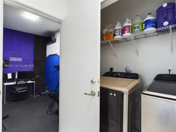 a utility room with dryer and washer
