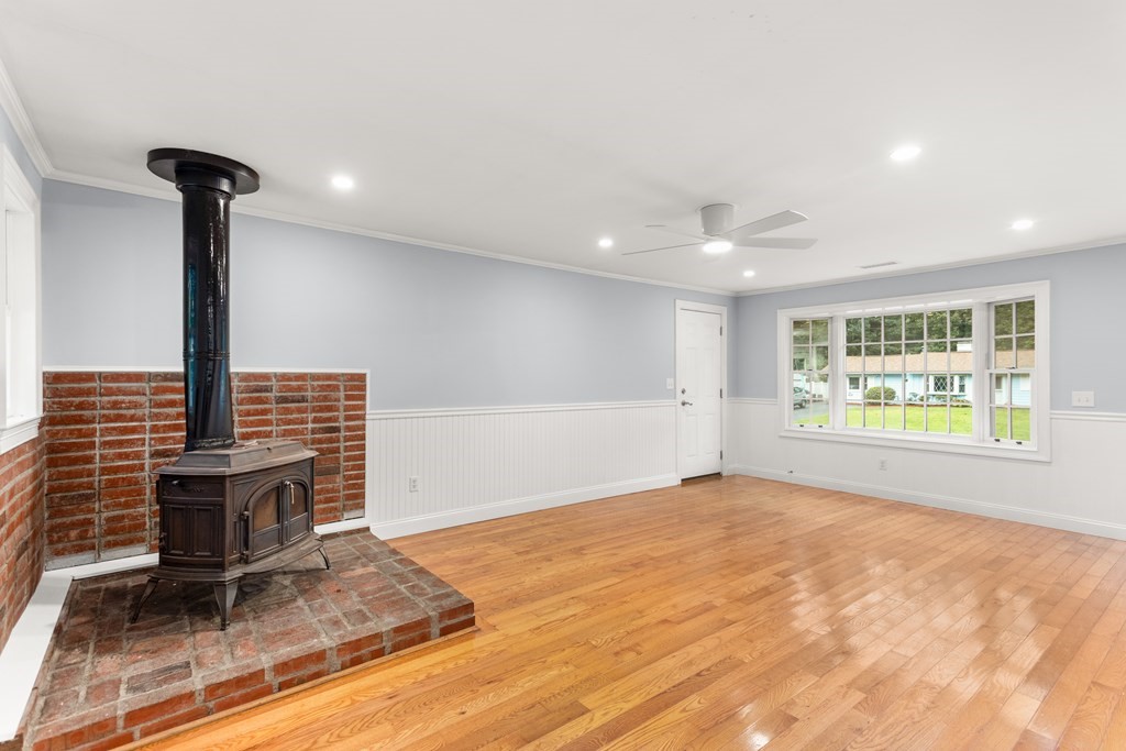 14 Fairbrook Road Framingham, MA 01701 - Photo 15 of 24 a view of an empty room with a fireplace and a window