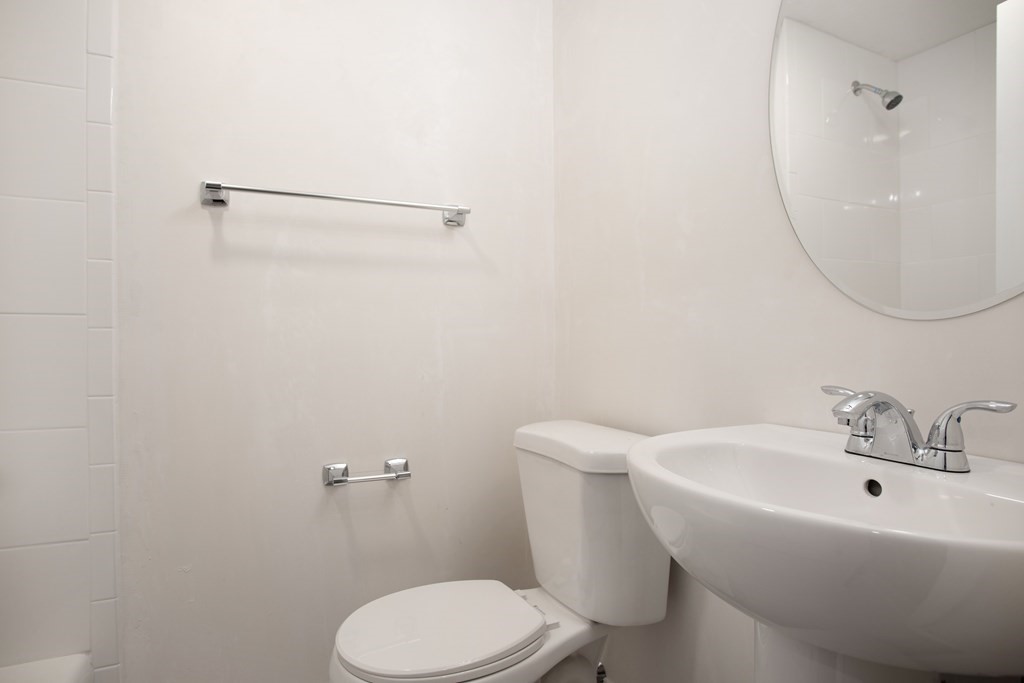 14 Fairbrook Road Framingham, MA 01701 - Photo 24 of 24 a white toilet sitting next to a bathroom sink