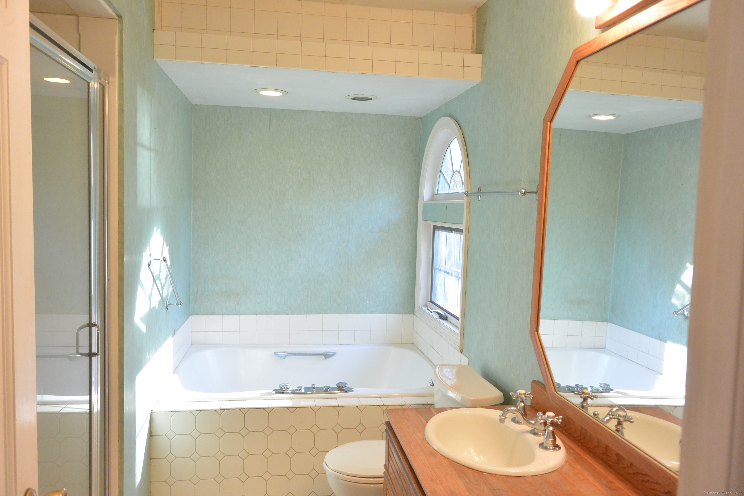 439 Cheese Spring Road New Canaan, CT 06840 - Photo 15 of 36 a bathroom with a granite countertop sink mirror vanity and toilet
