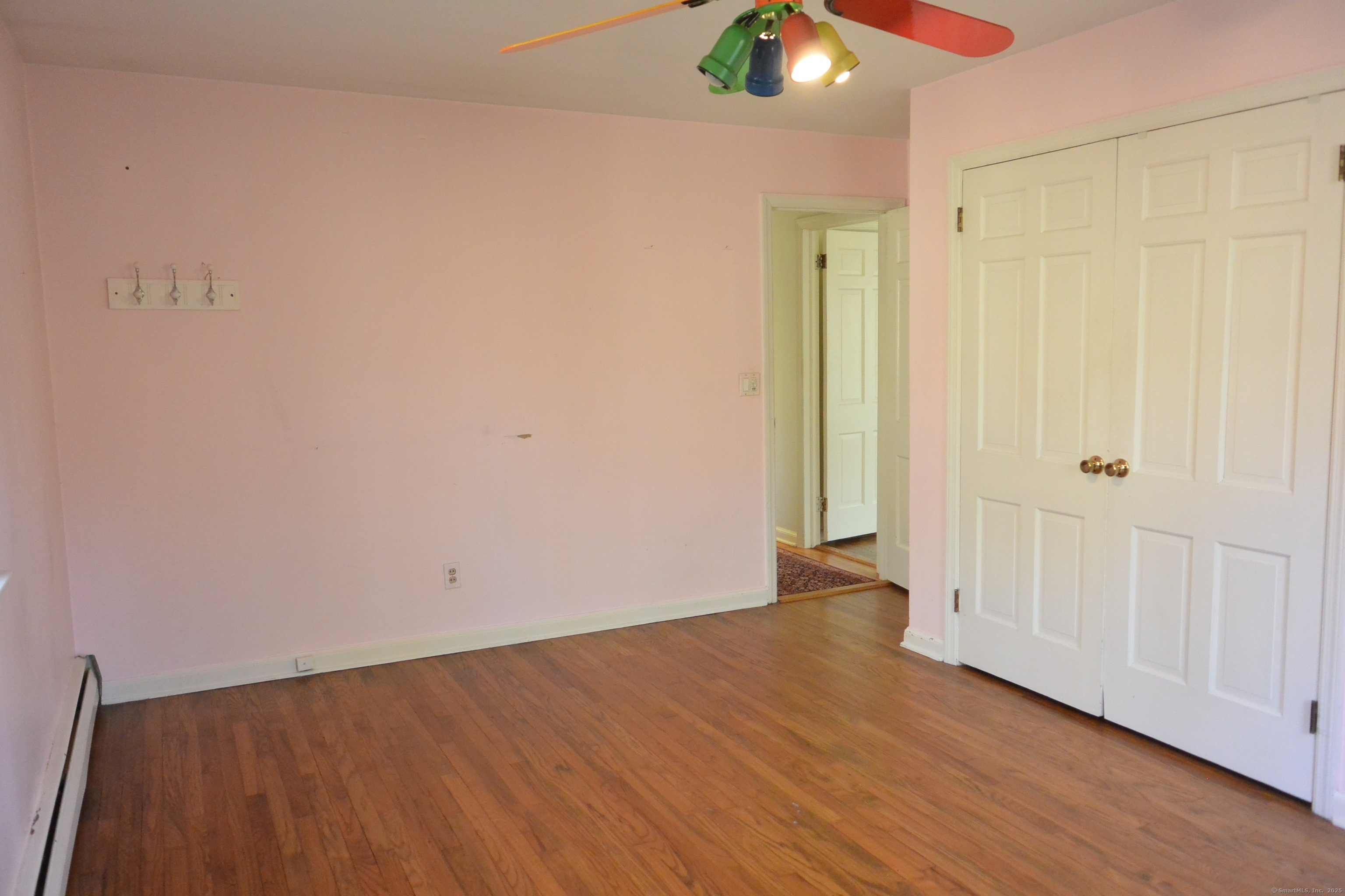 439 Cheese Spring Road New Canaan, CT 06840 - Photo 17 of 36 a view of an empty room with wooden floor