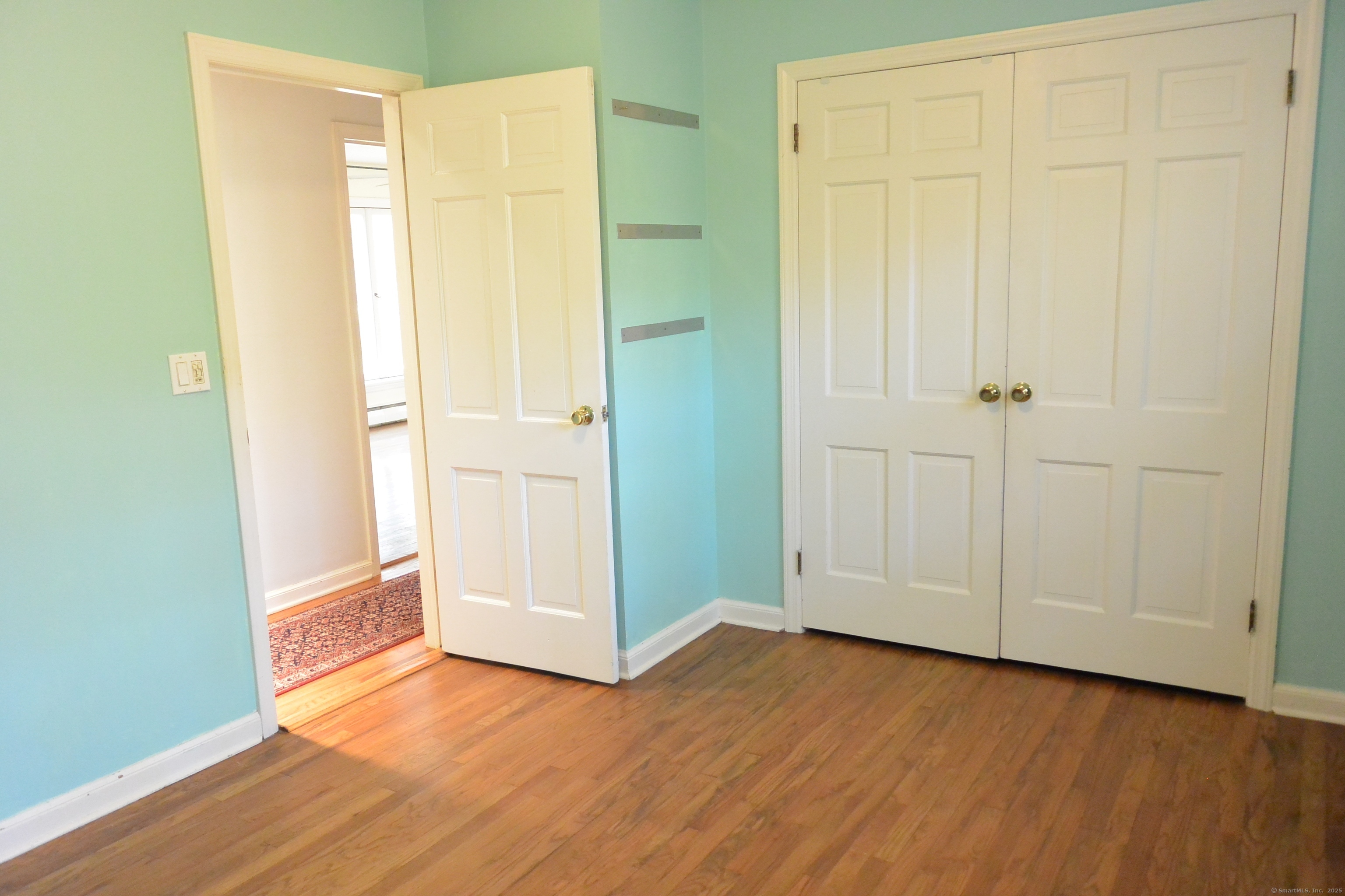 439 Cheese Spring Road New Canaan, CT 06840 - Photo 19 of 36 an empty room with wooden floor