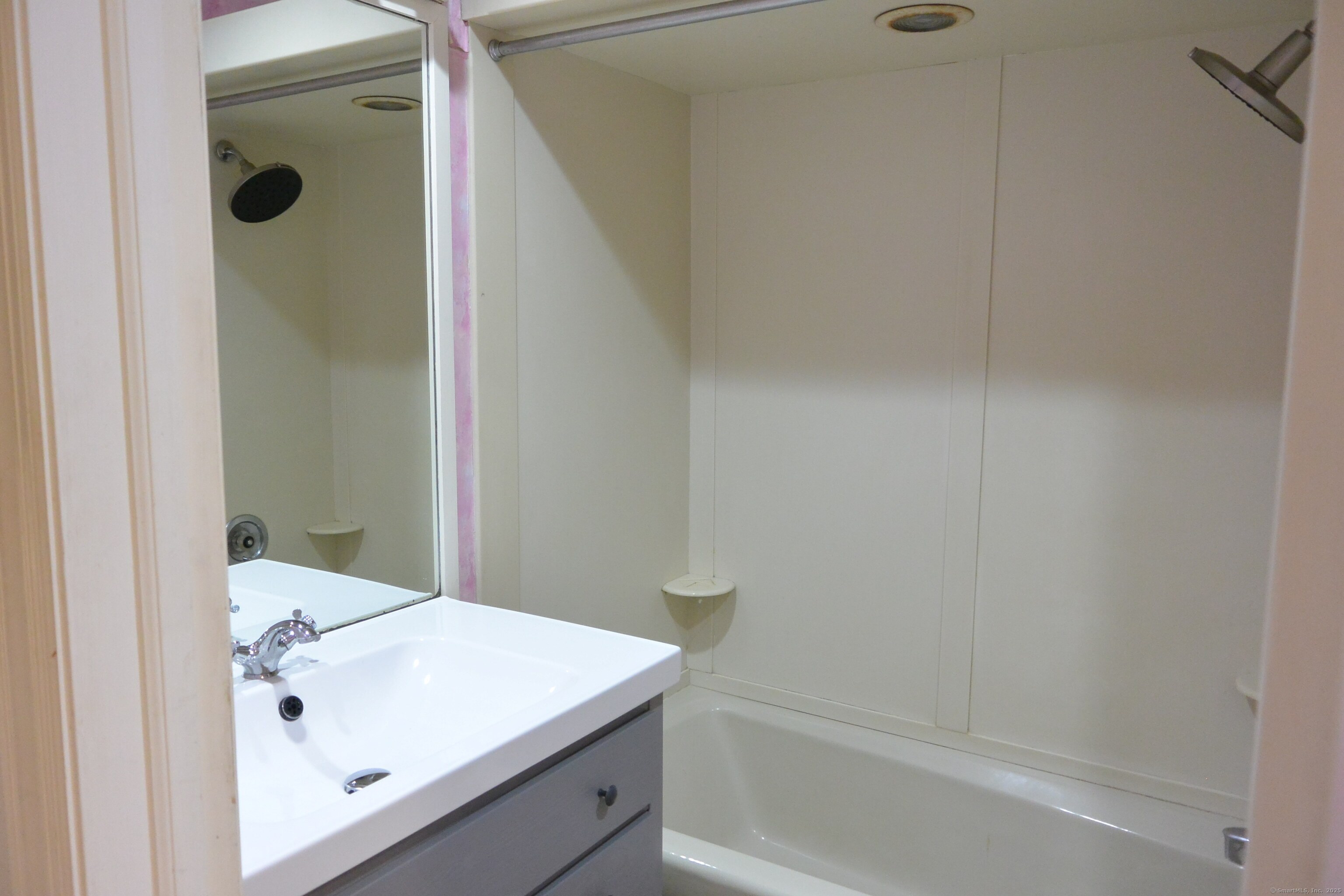 439 Cheese Spring Road New Canaan, CT 06840 - Photo 20 of 36 a bathroom with a sink and mirror