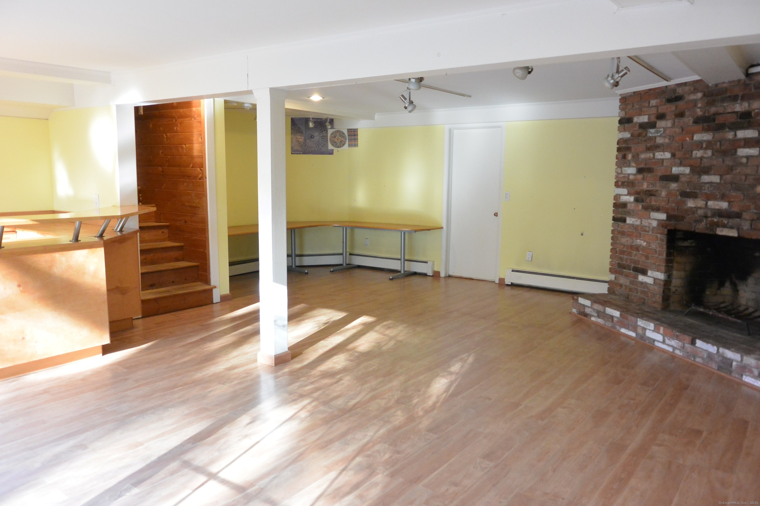 439 Cheese Spring Road New Canaan, CT 06840 - Photo 22 of 36 a view of a livingroom with a fireplace and a window