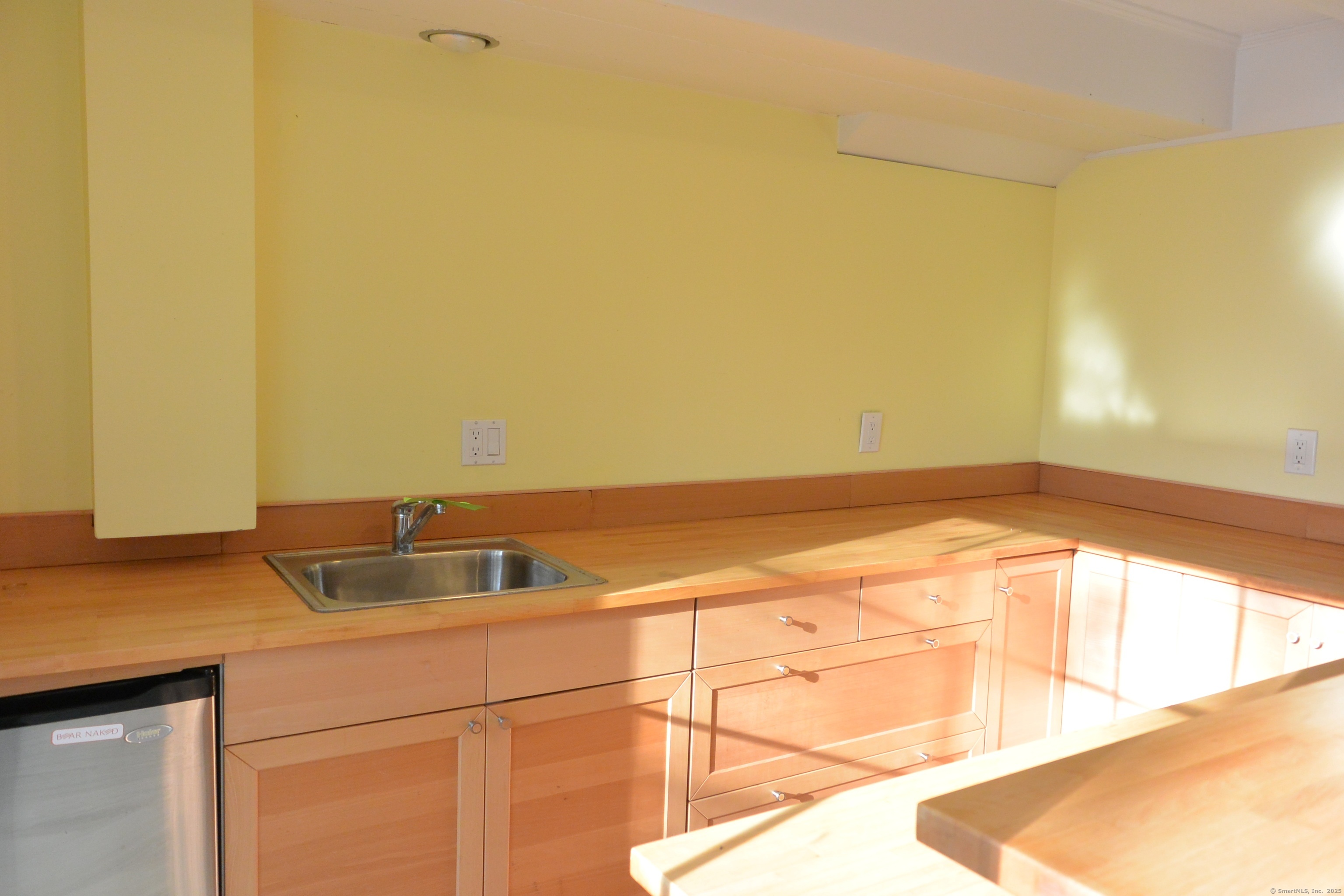 439 Cheese Spring Road New Canaan, CT 06840 - Photo 24 of 36 a kitchen with a sink and cabinets