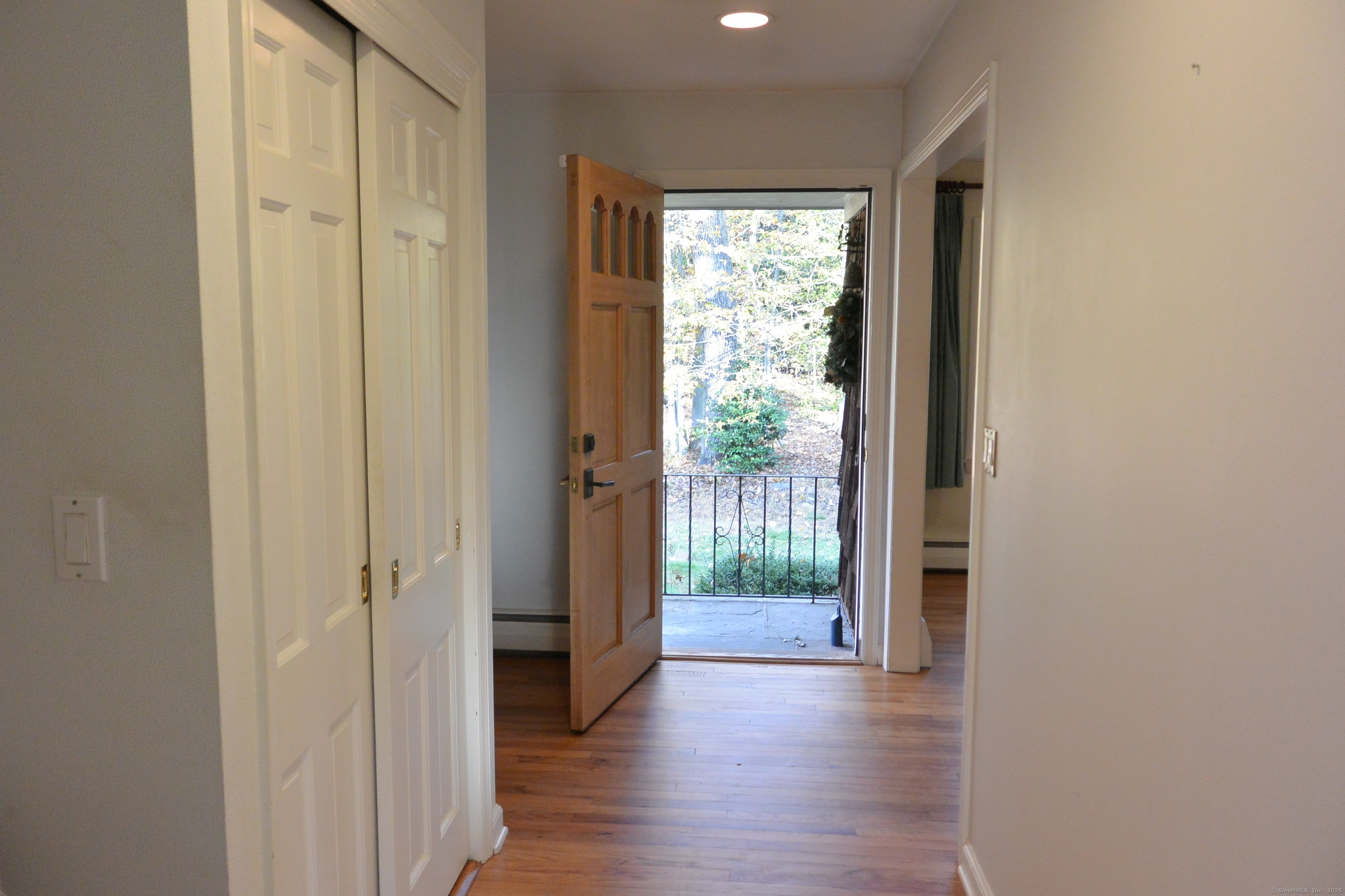 439 Cheese Spring Road New Canaan, CT 06840 - Photo 3 of 36 a view of a hallway with wooden floor