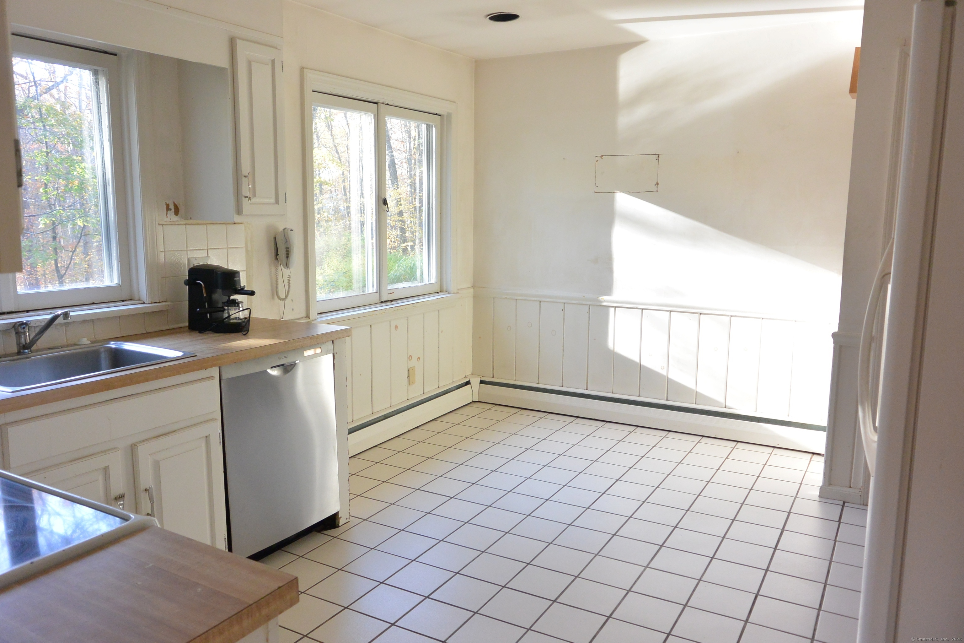 439 Cheese Spring Road New Canaan, CT 06840 - Photo 10 of 36 a view of a kitchen with a sink and windows