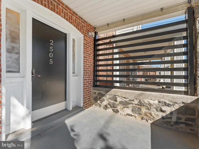 a view of a livingroom with wooden floor and windows