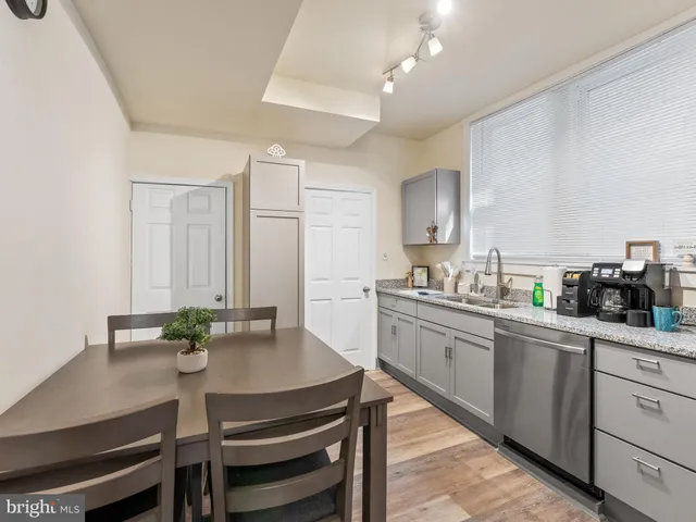 a kitchen with a table and chairs in it