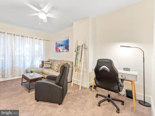 a work room with furniture and a window