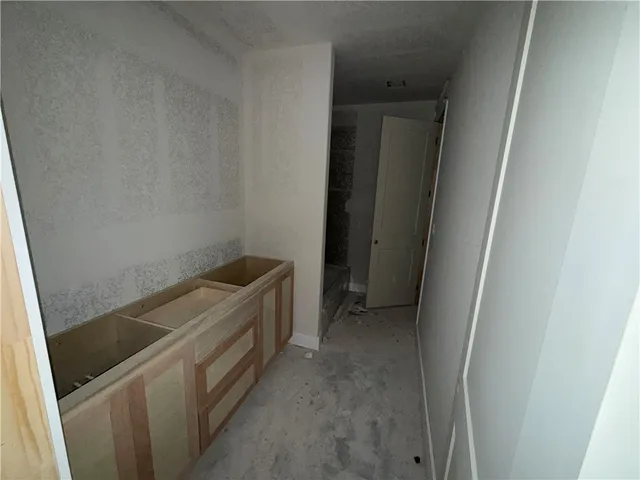 a view of storage and utility room with washer and dryer