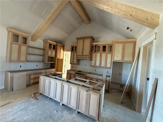 a kitchen with stainless steel appliances a refrigerator and a stove