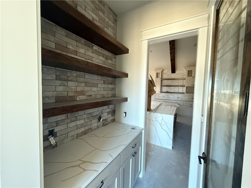 7822 Mathis Crk Drive Bryan, TX 77808 - Photo 4 of 20 a kitchen with a refrigerator and a stove