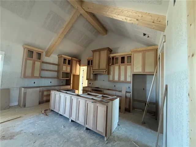 a kitchen that has a lot of cabinets in it