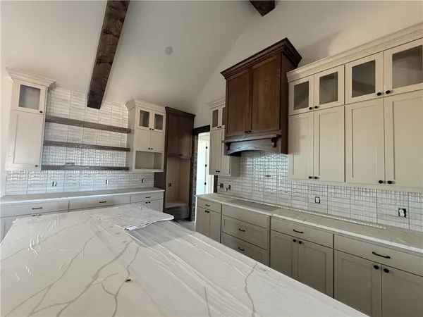 a kitchen with a sink and cabinets