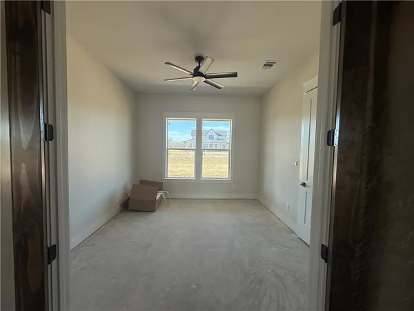 a view of an empty room with a window