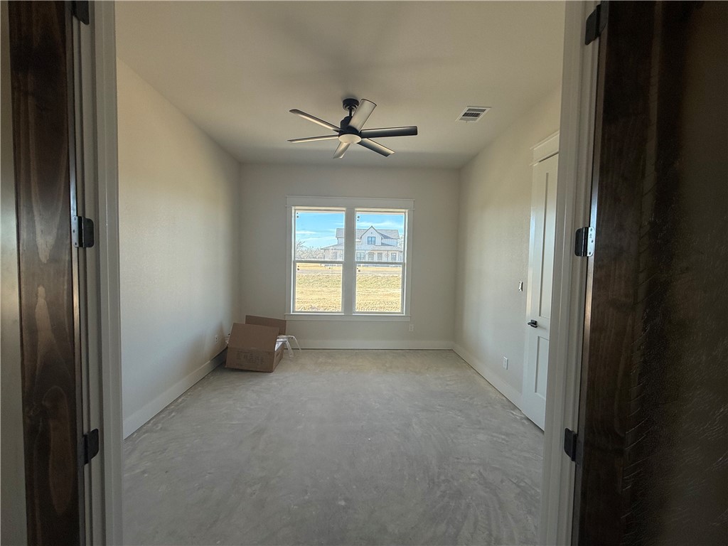 7822 Mathis Crk Drive Bryan, TX 77808 - Photo 8 of 20 a view of an empty room with a window