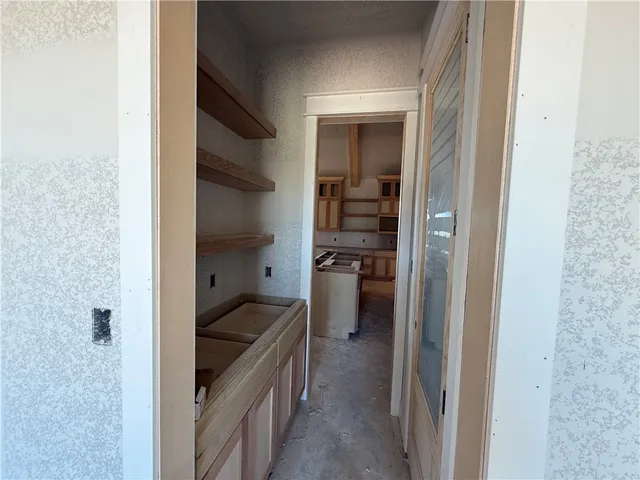 a kitchen with a refrigerator and an stove