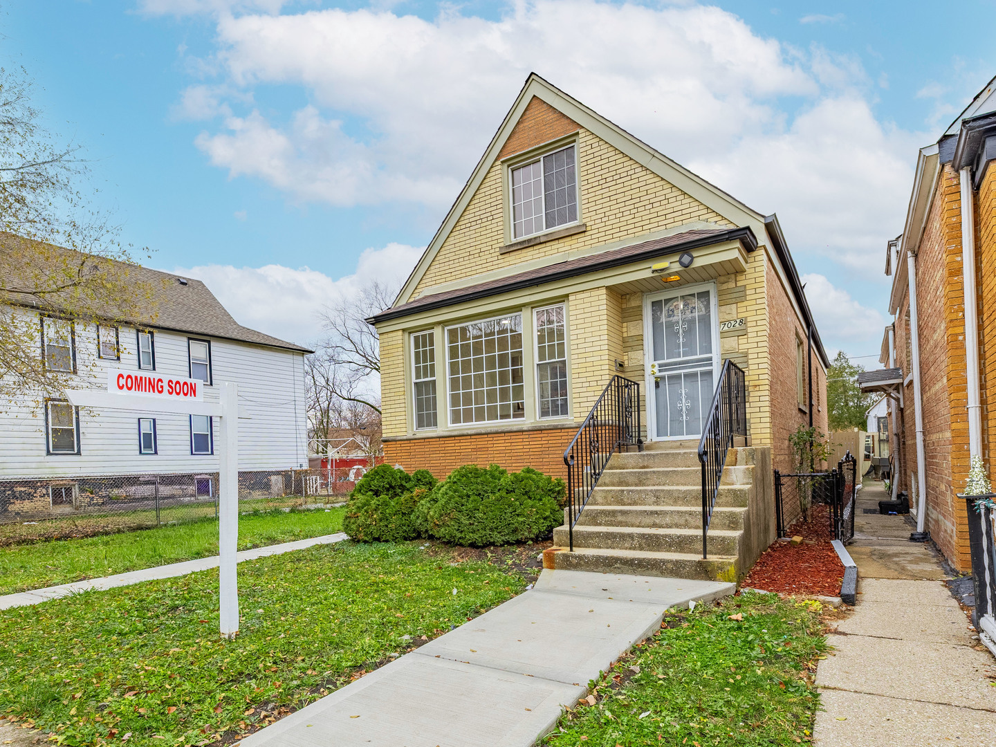 7028 South Honore Street Chicago, IL 60636 - Photo 1 of 18 a front view of a house with a yard and porch