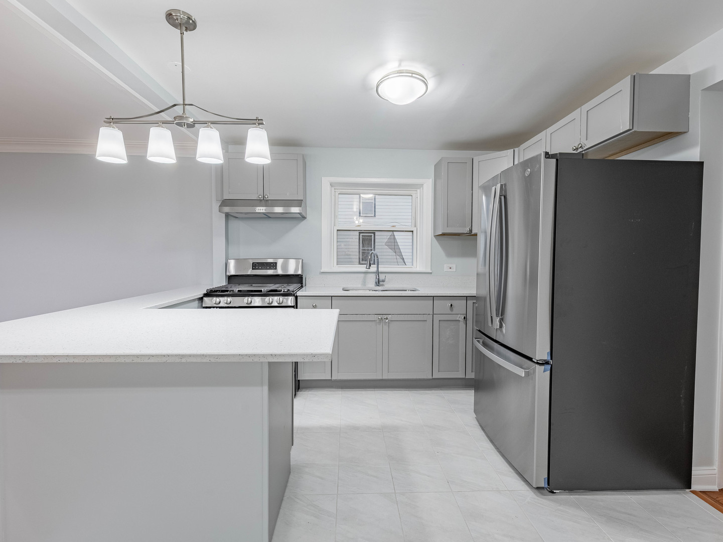 7028 South Honore Street Chicago, IL 60636 - Photo 4 of 18 a kitchen with a refrigerator a sink and dishwasher