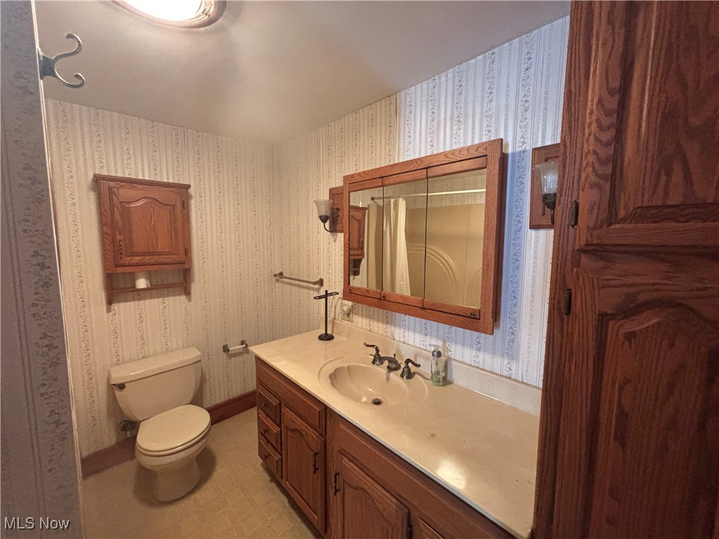 11592 Taylor Wells Road Chardon, OH 44024 - Photo 25 of 37 Bathroom featuring vanity and toilet