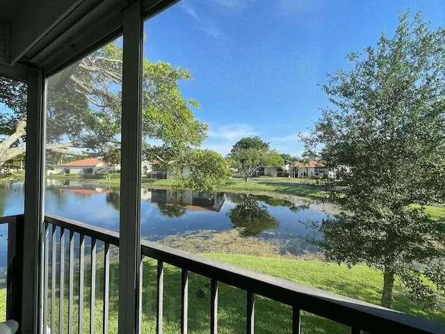 a view of a lake from a balcony