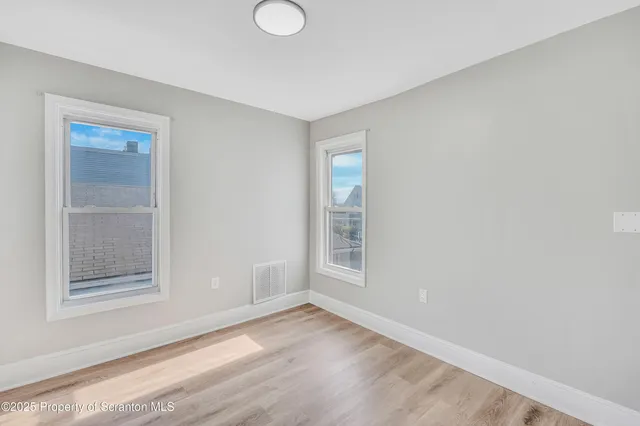 an empty room with windows