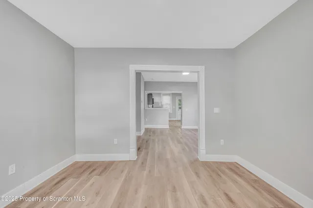 a view of wooden floor in an empty room