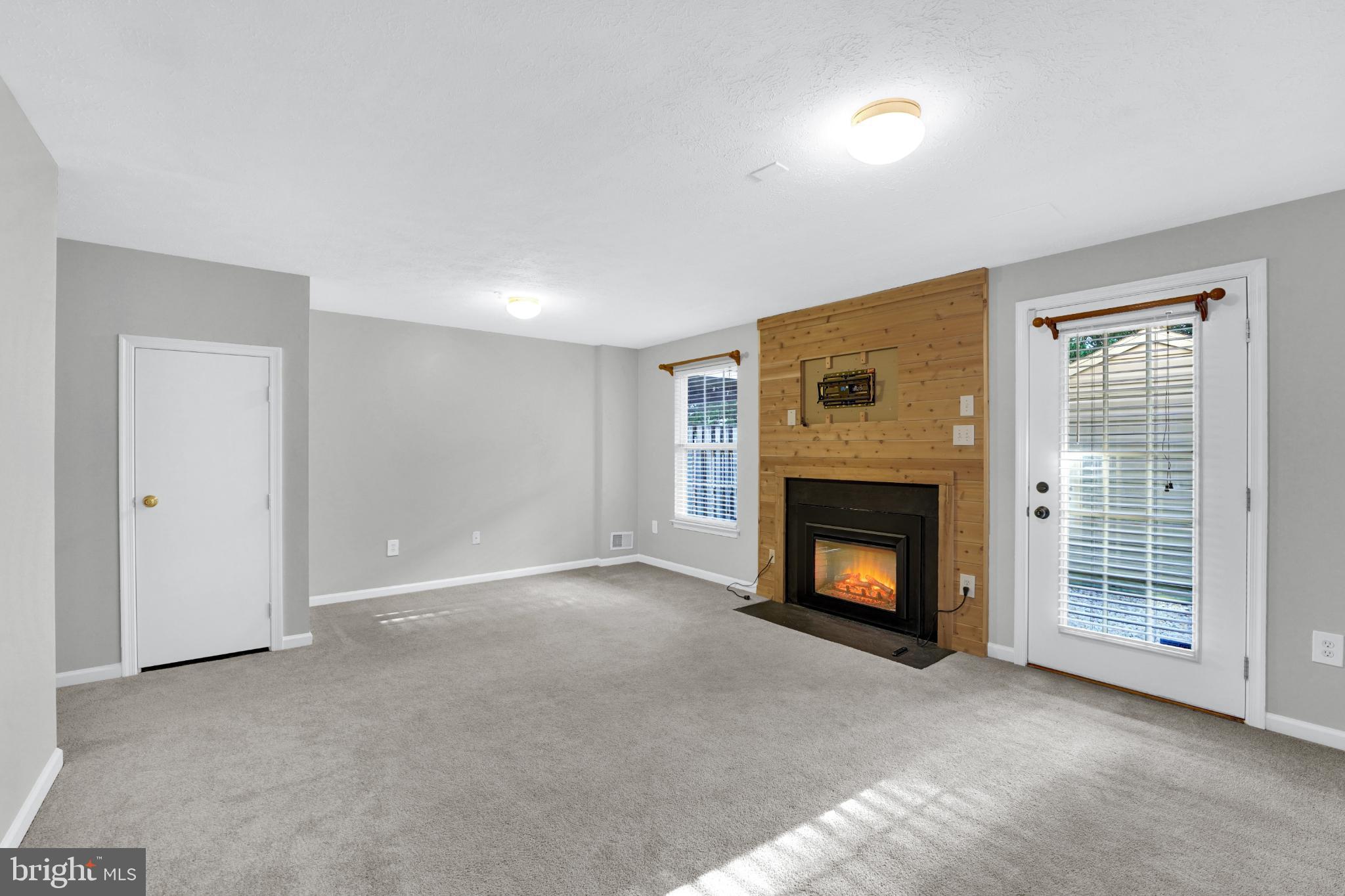 265 Cherry Tree Square Forest Hill, MD 21050 - Photo 24 of 29 Cozy bsmt rec room with electric fireplace.