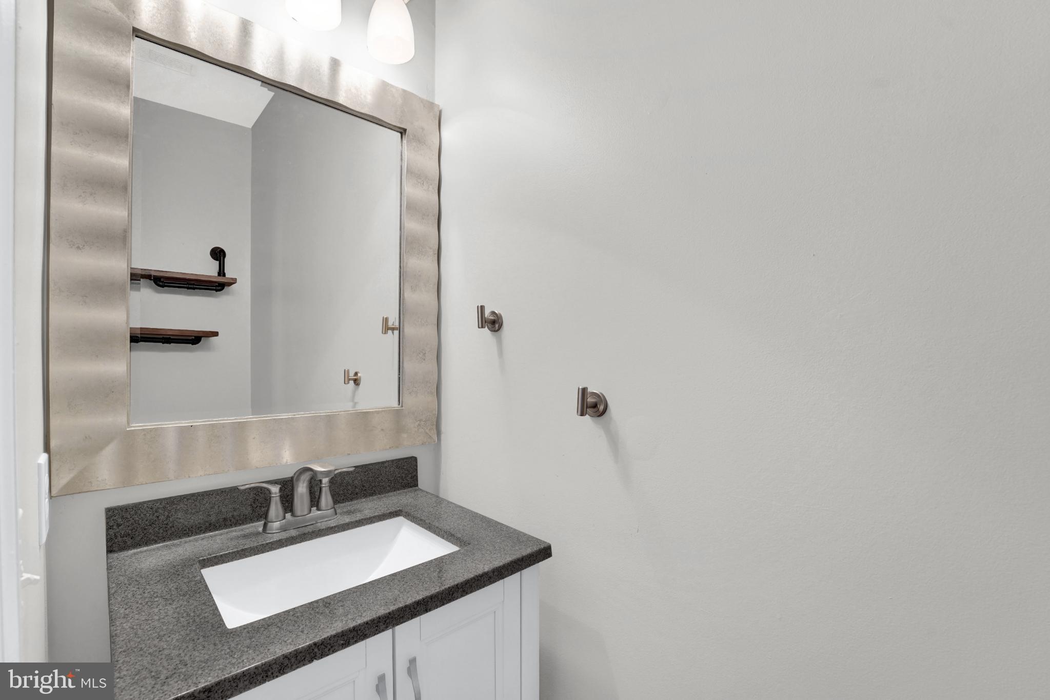 265 Cherry Tree Square Forest Hill, MD 21050 - Photo 6 of 29 Sleek 1st floor powder room with modern finishes.