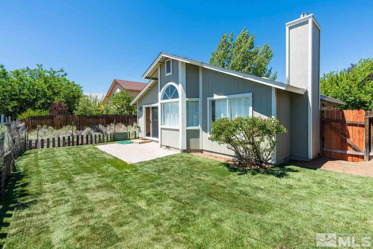 6542 Fall River Circle Reno, NV 89523 - Photo 14 of 17 a front view of a house with garden
