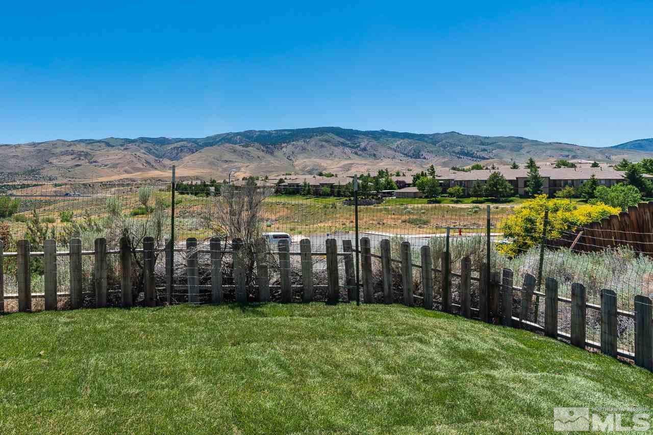6542 Fall River Circle Reno, NV 89523 - Photo 16 of 17 a view of a house with a garden and lake view