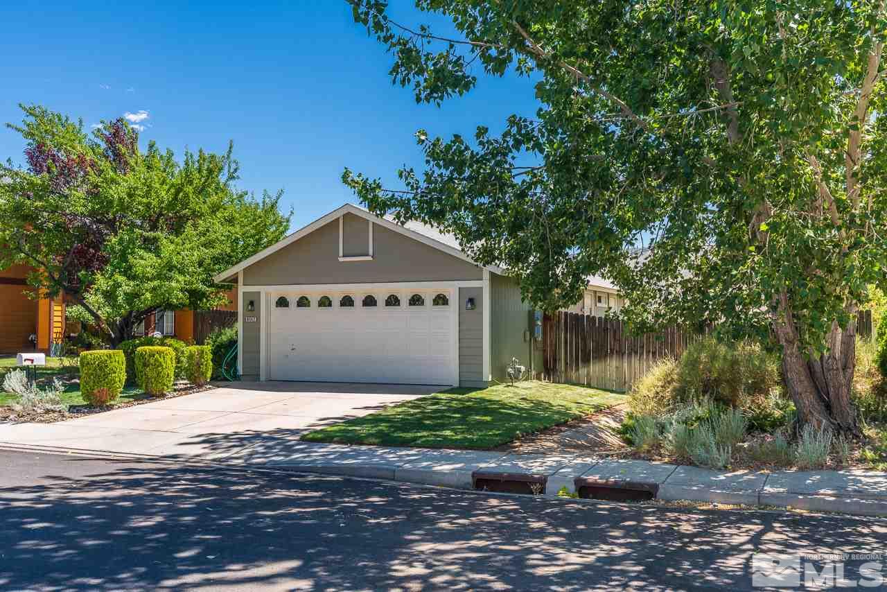 6542 Fall River Circle Reno, NV 89523 - Photo 2 of 17 a front view of a house with a yard and garage