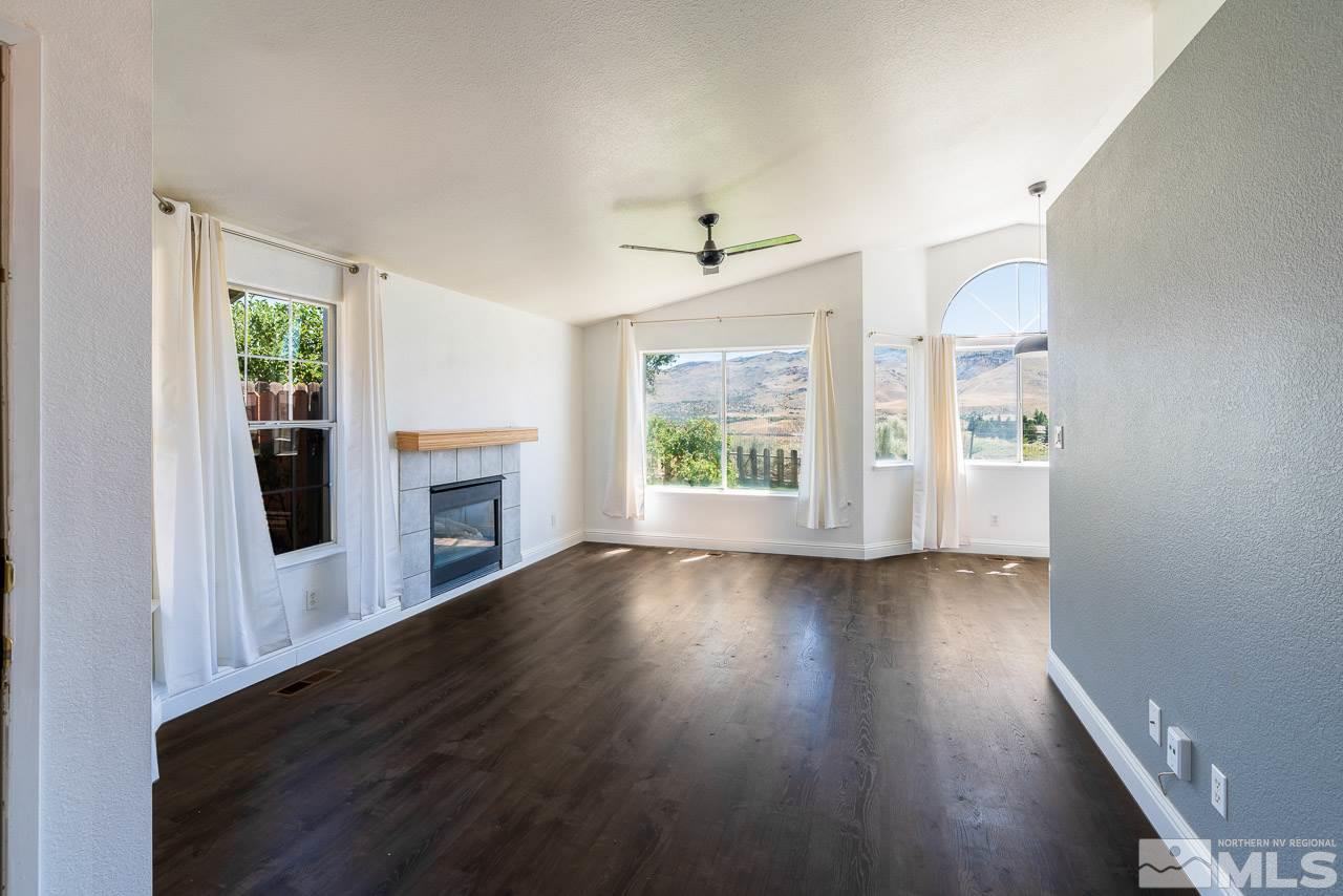 6542 Fall River Circle Reno, NV 89523 - Photo 3 of 17 wooden floor in an empty room with a window