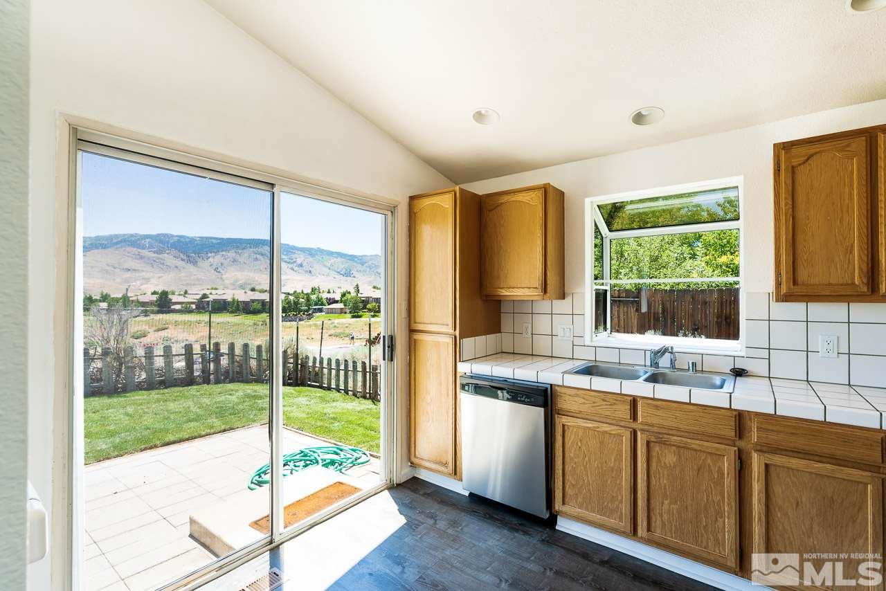 6542 Fall River Circle Reno, NV 89523 - Photo 7 of 17 a kitchen that has a sink and a large window