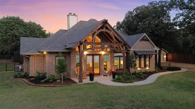 a view of a backyard of the house with chairs