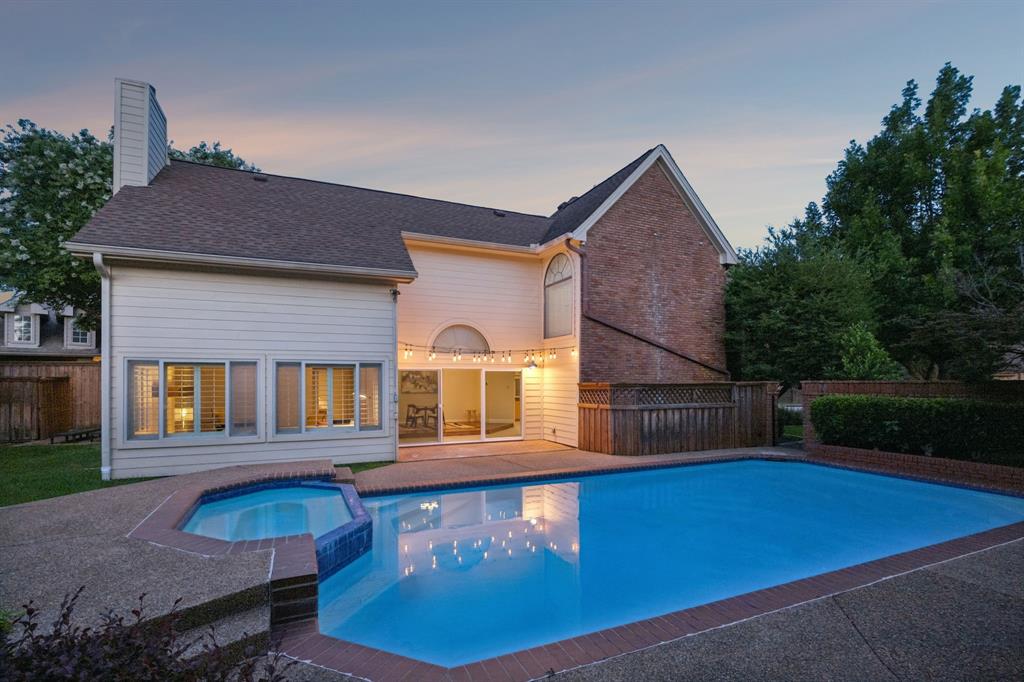 4115 Rive Lane Addison, TX 75001 - Photo 21 of 25 Outdoor living space featuring a swimming pool, integrated spa, and concrete decking