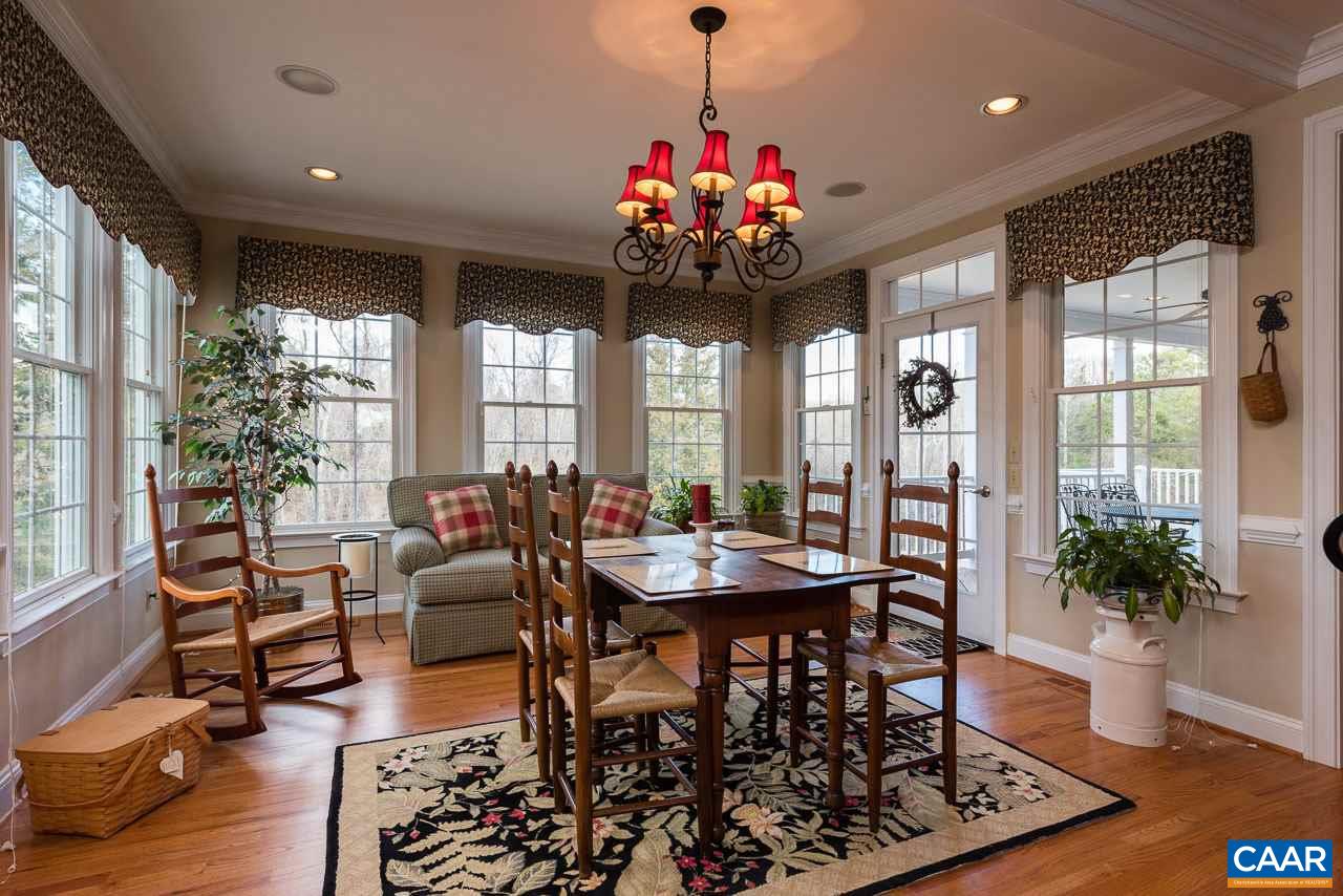 988 Woodlands Road Charlottesville, VA 22901 - Photo 8 of 23 Breakfast Room in Kitchen, huge windows and natural light, access to covered porch and views of backyard. Back staircase to second floor to the left.