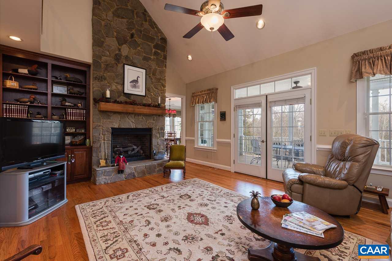 988 Woodlands Road Charlottesville, VA 22901 - Photo 10 of 23 Family Room Raised Hearth Stone Fireplace. French-doors open to beautiful covered porch.