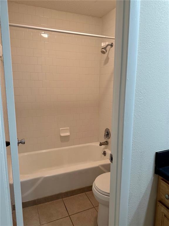 3301 Henderson Mill Road, Unit E7 Atlanta, GA 30341 - Photo 7 of 8 a bathroom with a shower a toilet and a tub