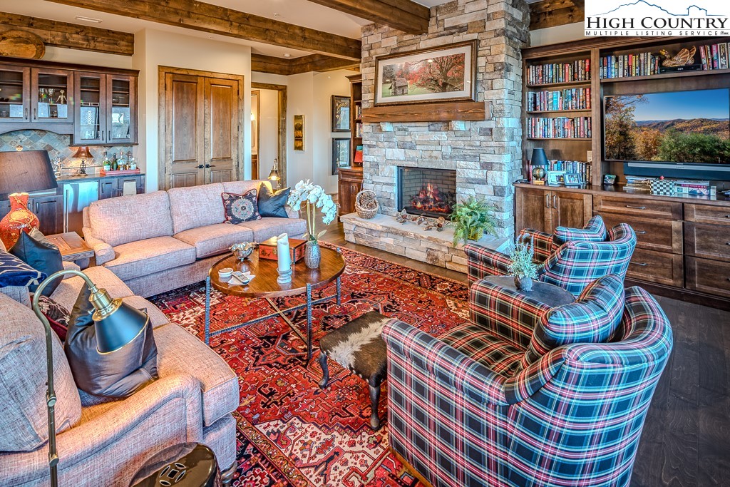 215 Cone Vista Circle, Unit B Blowing Rock, NC 28605 - Photo 11 of 50 a outdoor living space with patio furniture and a fireplace