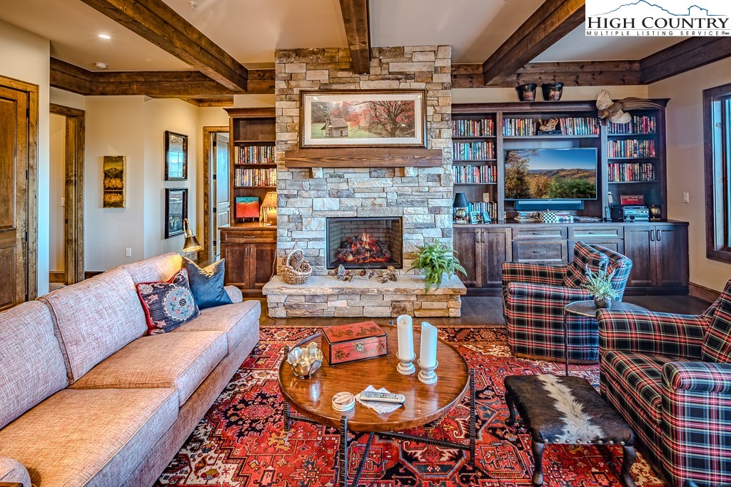 215 Cone Vista Circle, Unit B Blowing Rock, NC 28605 - Photo 12 of 50 a living room with furniture and a fireplace