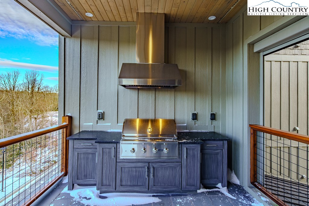 215 Cone Vista Circle, Unit B Blowing Rock, NC 28605 - Photo 19 of 50 a kitchen with a sink a stove and a refrigerator