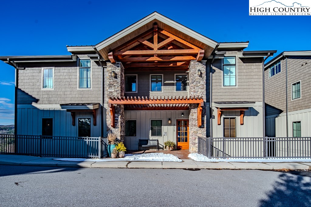 215 Cone Vista Circle, Unit B Blowing Rock, NC 28605 - Photo 2 of 50 a view of a house with entrance gate