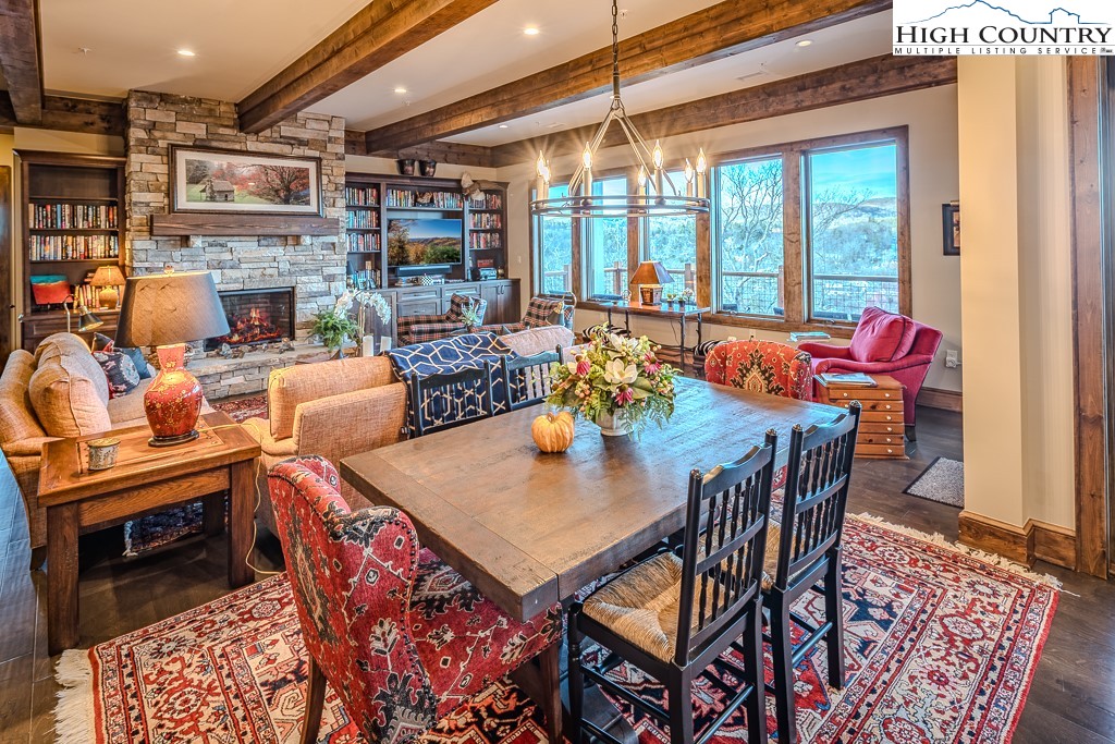 215 Cone Vista Circle, Unit B Blowing Rock, NC 28605 - Photo 24 of 50 a view of a dining room with furniture window and wooden floor