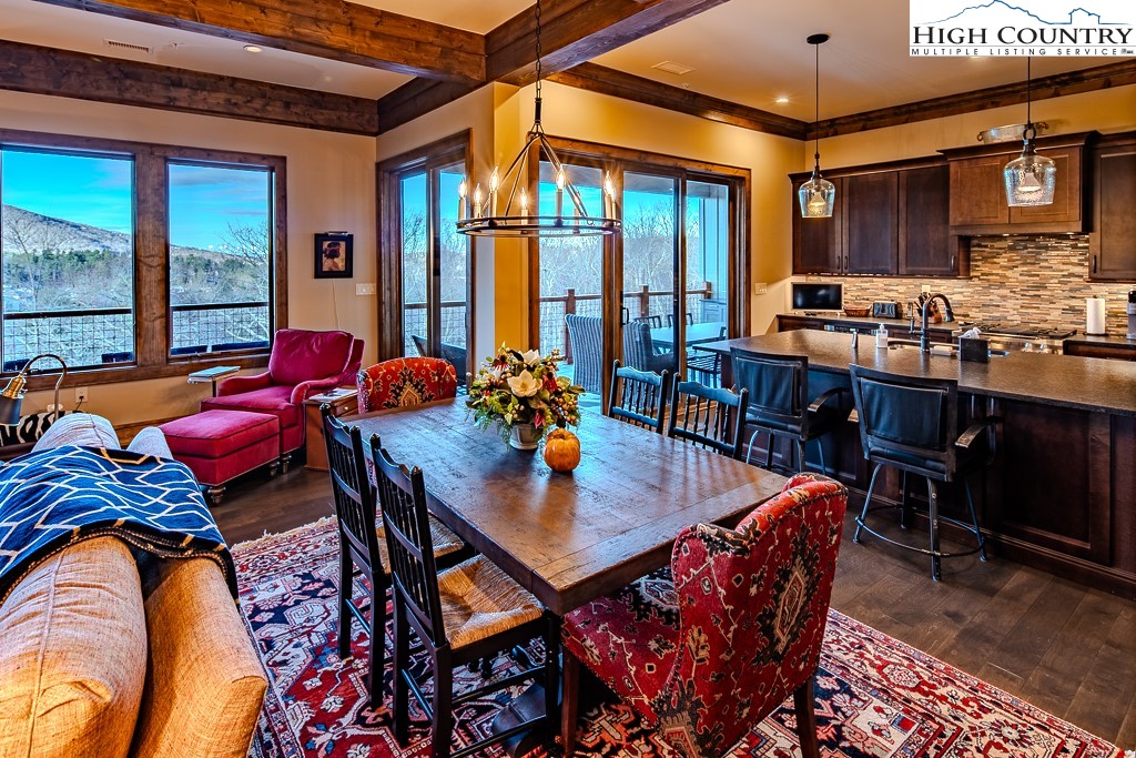 215 Cone Vista Circle, Unit B Blowing Rock, NC 28605 - Photo 25 of 50 a dining room with furniture and a potted plant