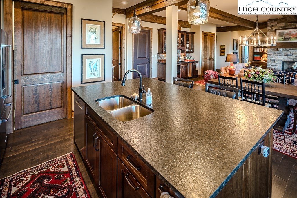 215 Cone Vista Circle, Unit B Blowing Rock, NC 28605 - Photo 28 of 50 an outdoor kitchen with granite countertop a sink a counter top space and stainless steel appliances