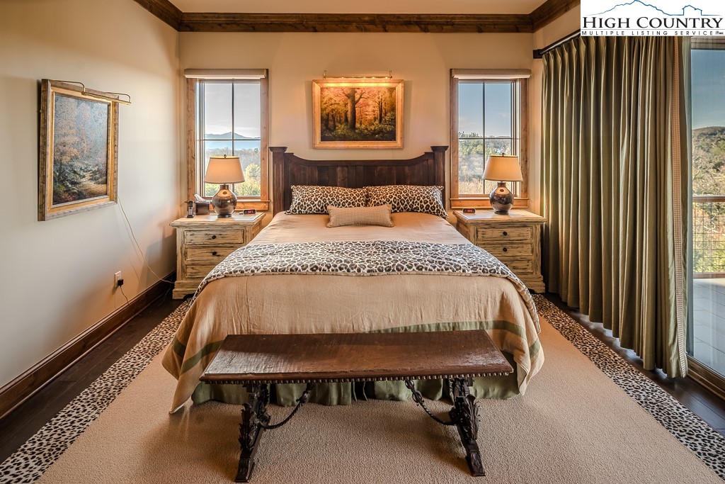 215 Cone Vista Circle, Unit B Blowing Rock, NC 28605 - Photo 33 of 50 a bed sitting in a bedroom next to a window