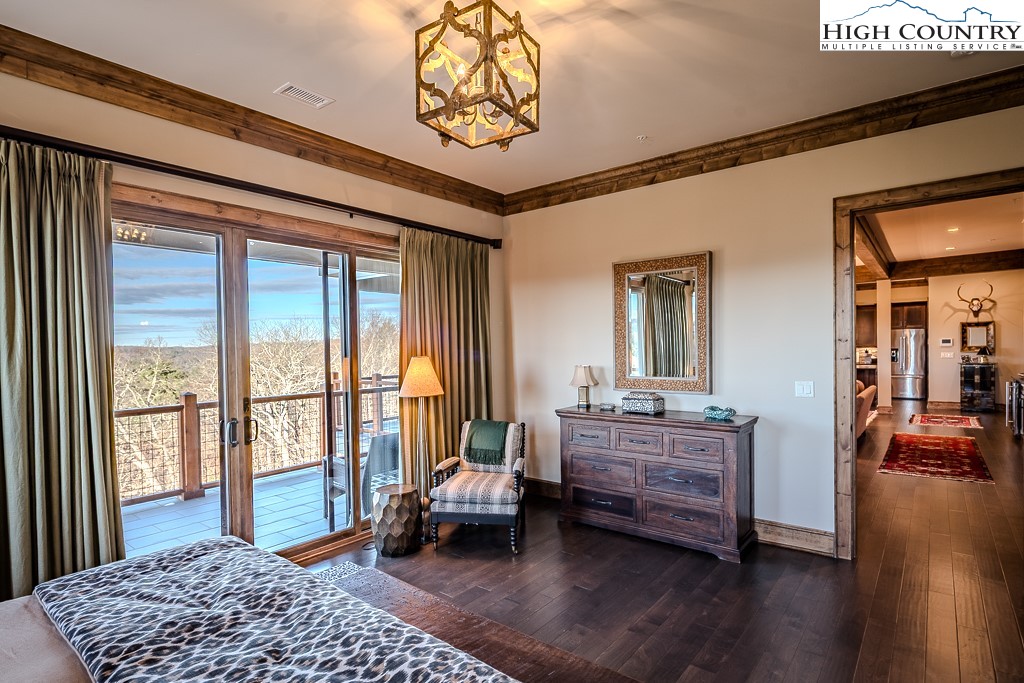 215 Cone Vista Circle, Unit B Blowing Rock, NC 28605 - Photo 35 of 50 a bedroom with furniture and a window